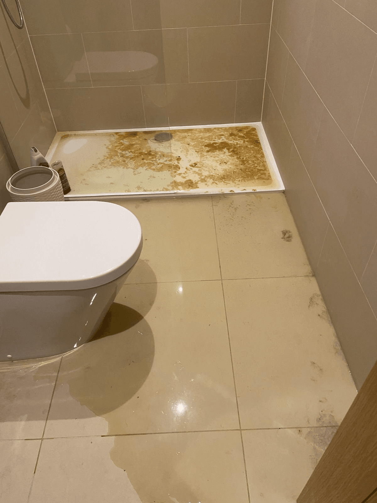 Drain overflow damage in bathroom